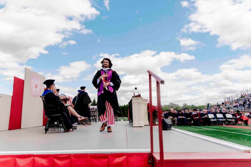 a man in a graduation gown