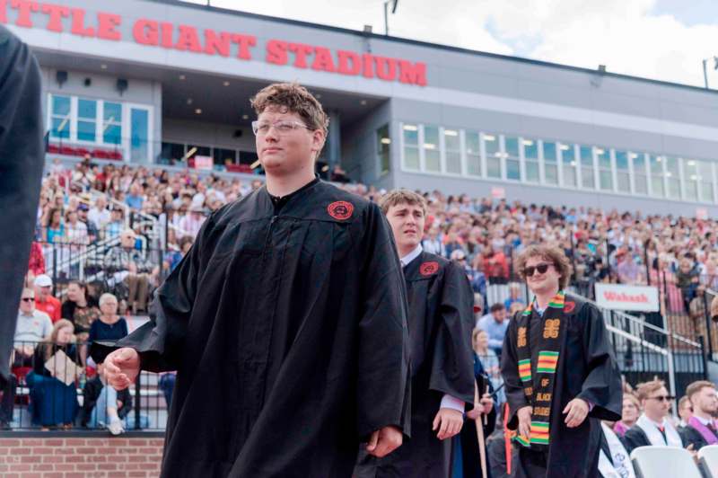 a group of people in graduation gowns