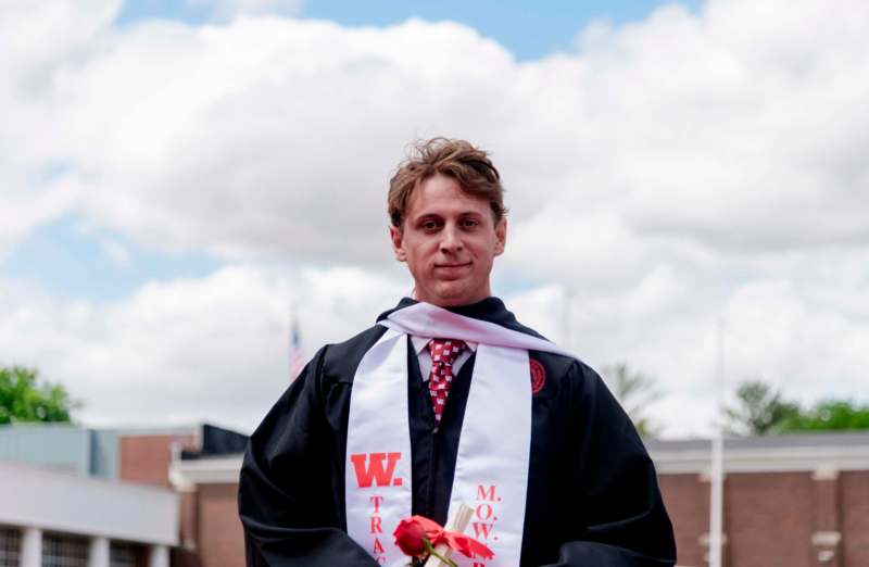 a man in a graduation gown