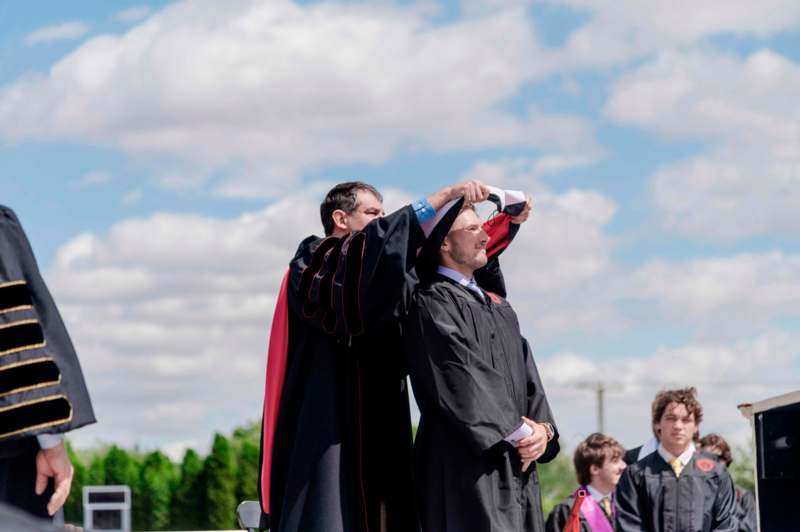 a man in black gowns and a man in black robe