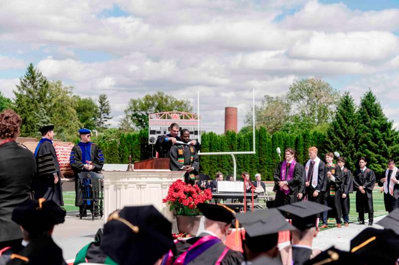 a group of people in graduation gowns