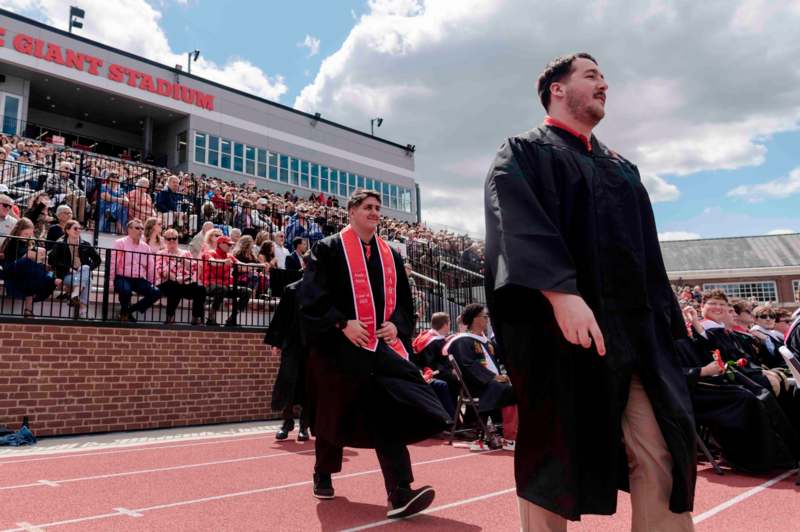 a group of people walking on a track