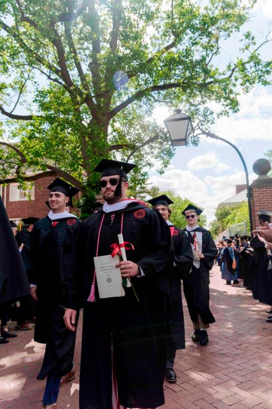 a group of people in graduation gowns and caps