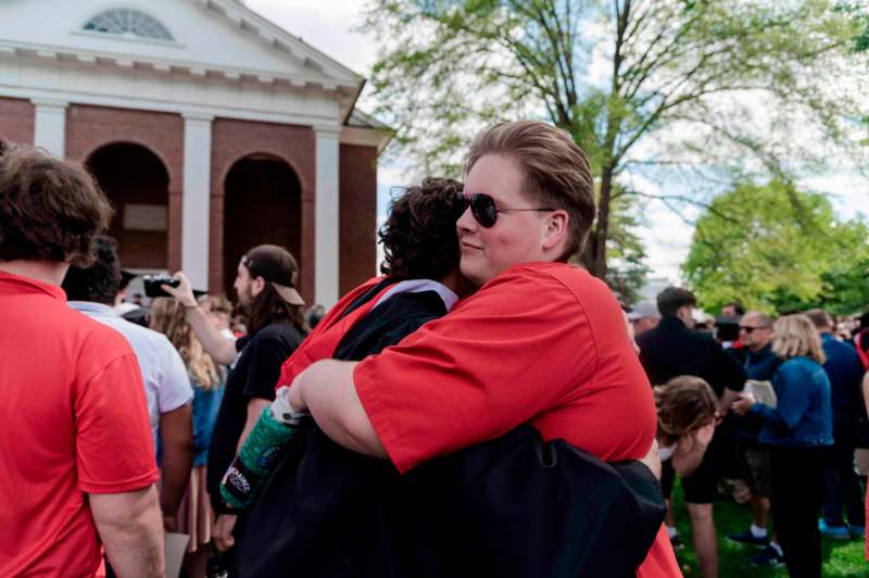 a man hugging another man