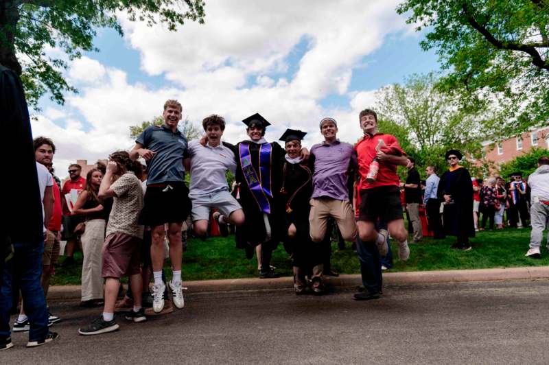 a group of people jumping in the air