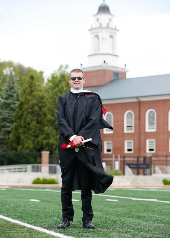 a man in a graduation gown