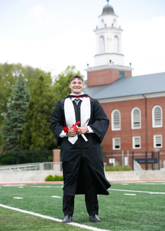 a man in a graduation gown