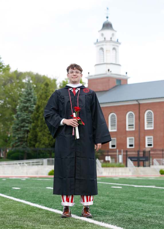 a man in a graduation gown