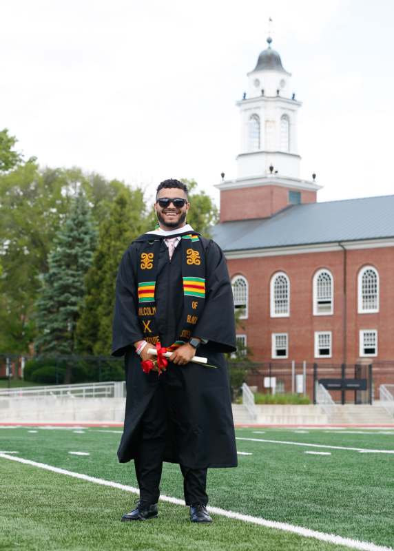 a man in a graduation gown