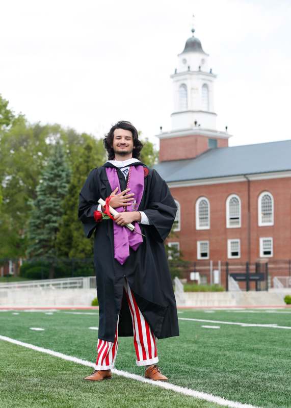 a man in a graduation gown