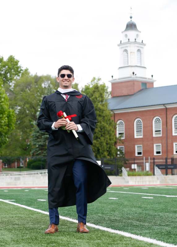 a man in a graduation gown