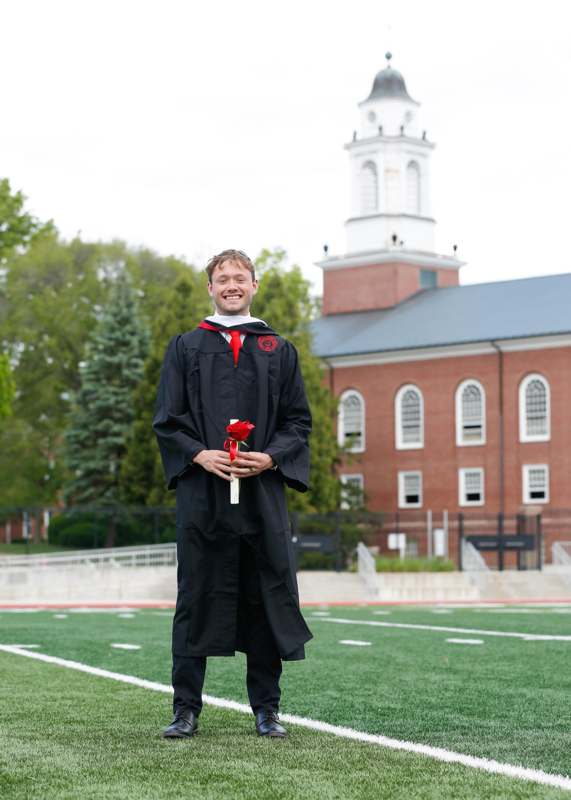 a man in a graduation gown