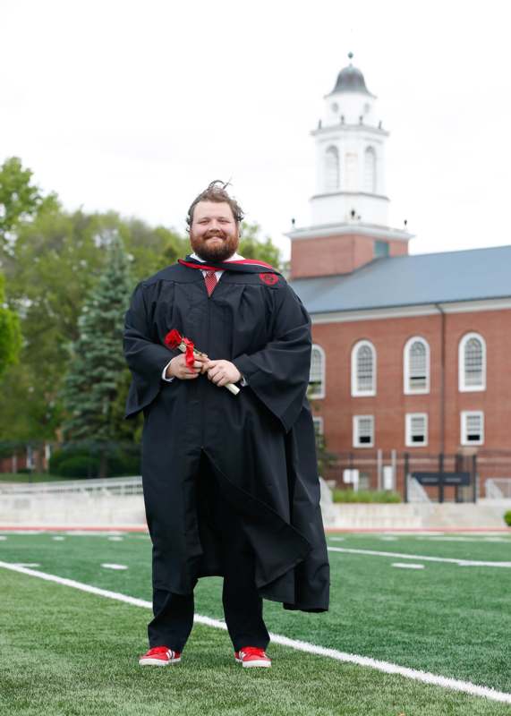 a man in a graduation gown