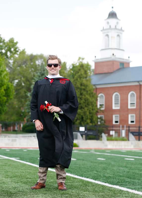 a man in a graduation gown