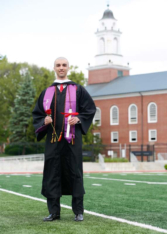 a man in a graduation gown