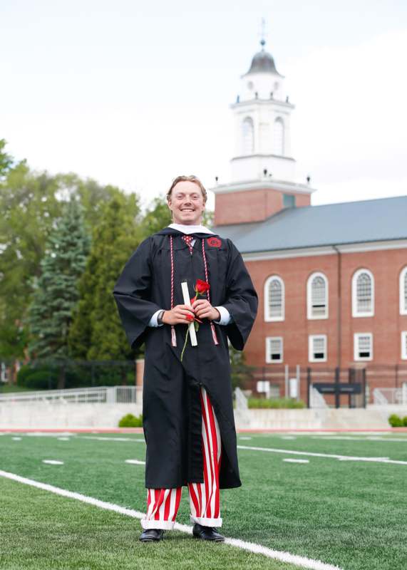 a man in a graduation gown