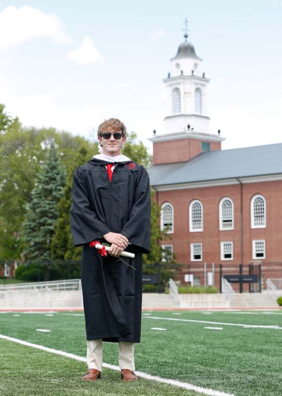 a man in a graduation gown