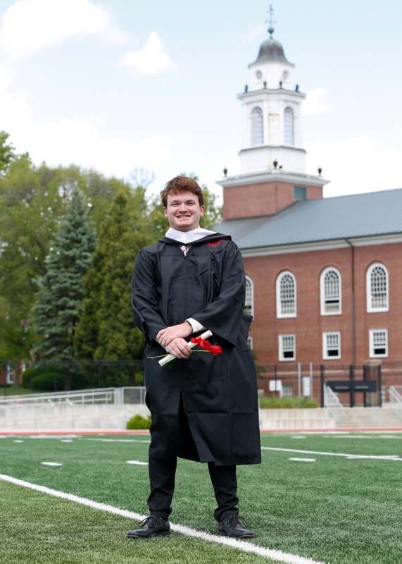 a man in a graduation gown
