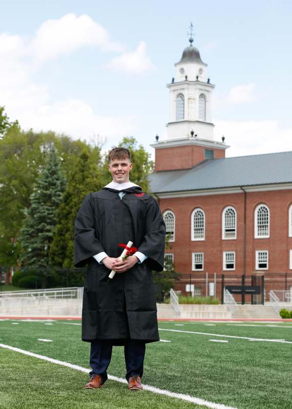 a man in a graduation gown