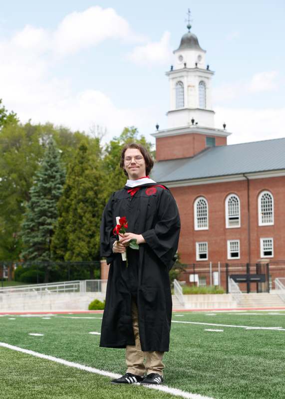 a man in a graduation gown