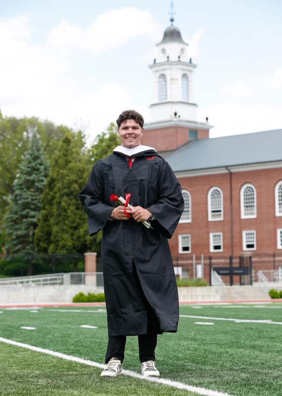 a man in a graduation gown