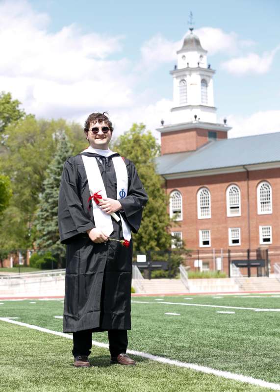 a man in a graduation gown