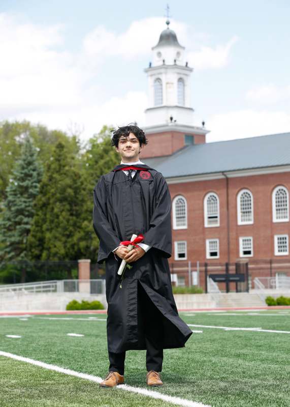 a man in a graduation gown