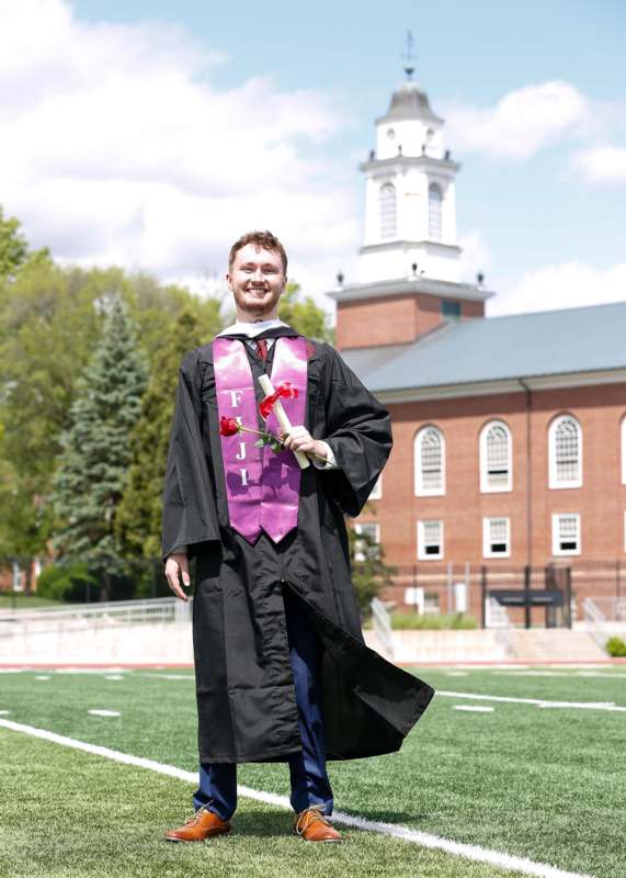 a man in a graduation gown