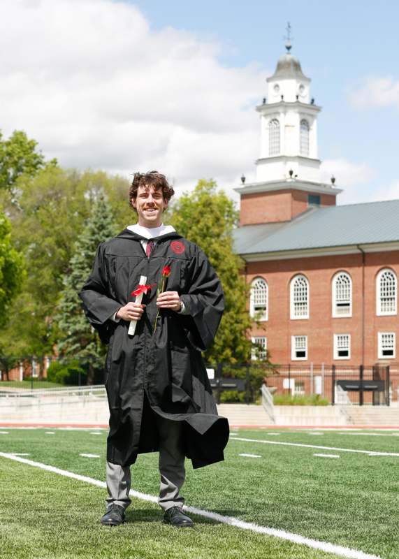 a man in a graduation gown
