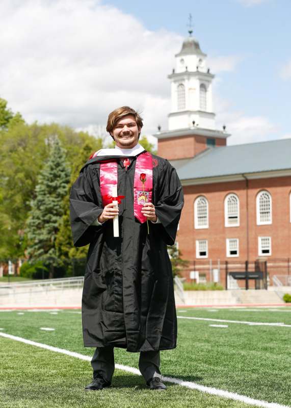 a man in a graduation gown