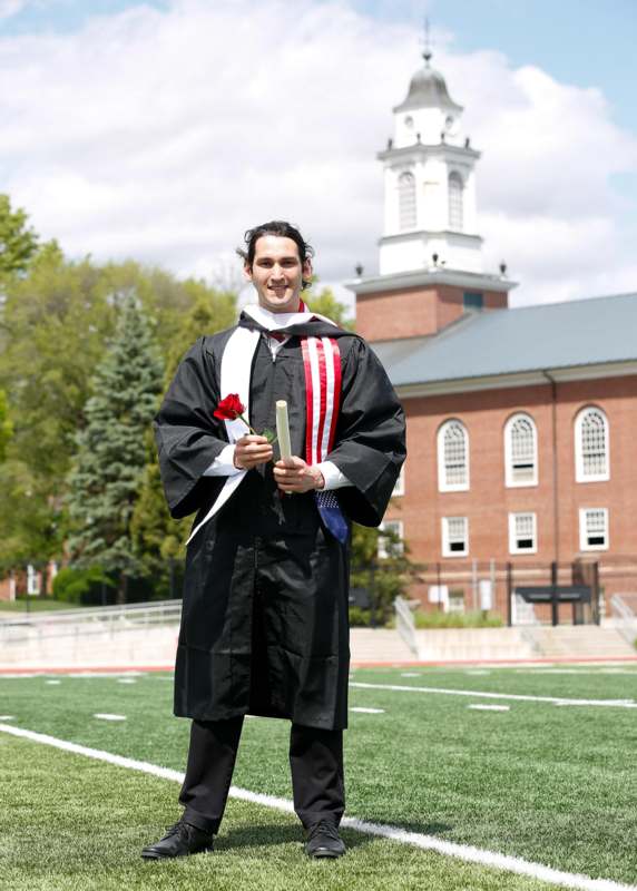 a man in a graduation gown