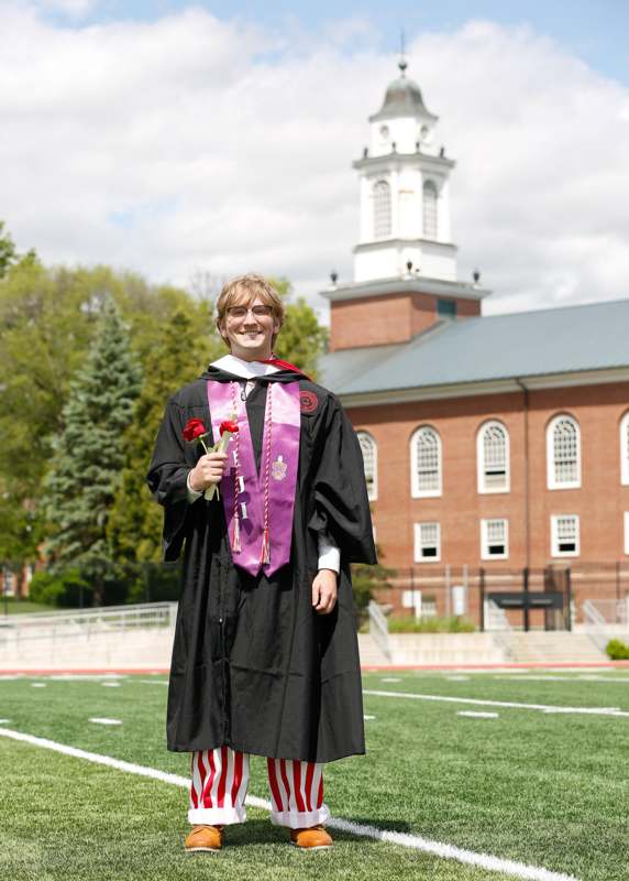a man in a graduation gown