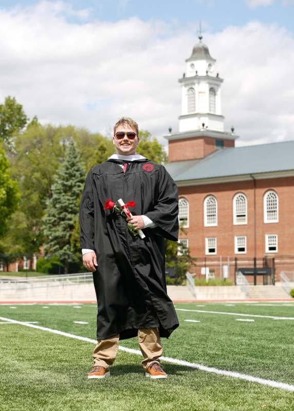 a man in a graduation gown