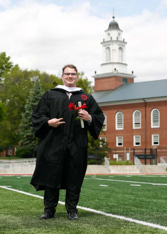 a man in a graduation gown