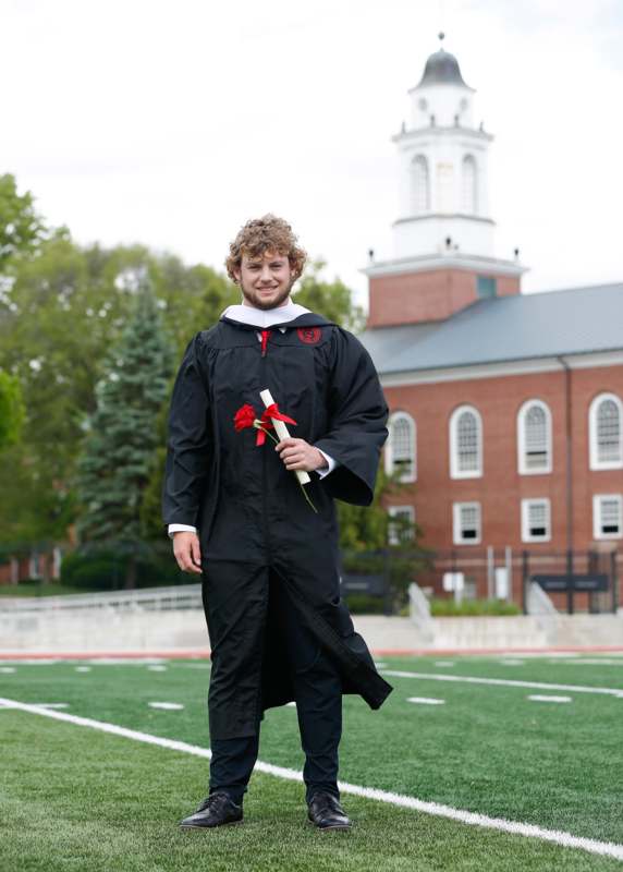 a man in a graduation gown