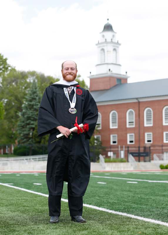 a man in a graduation gown