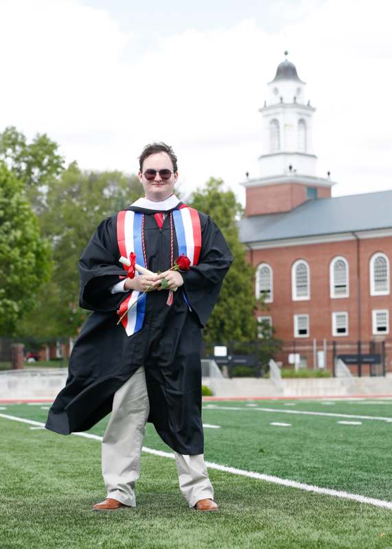 a man in a graduation gown