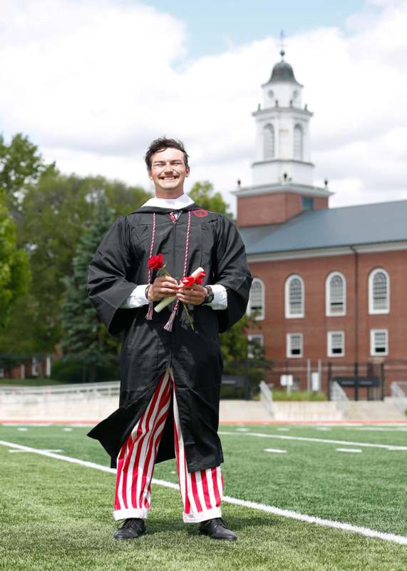 a man in a graduation gown