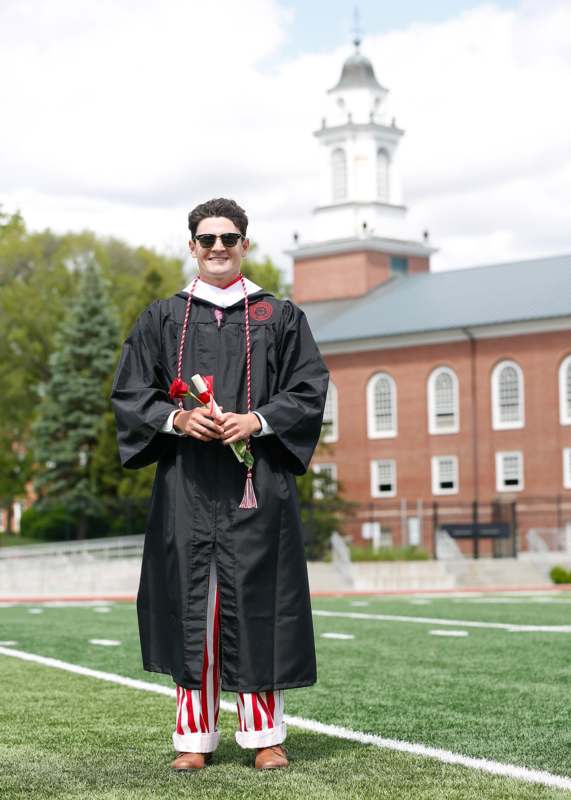 a man in a graduation gown