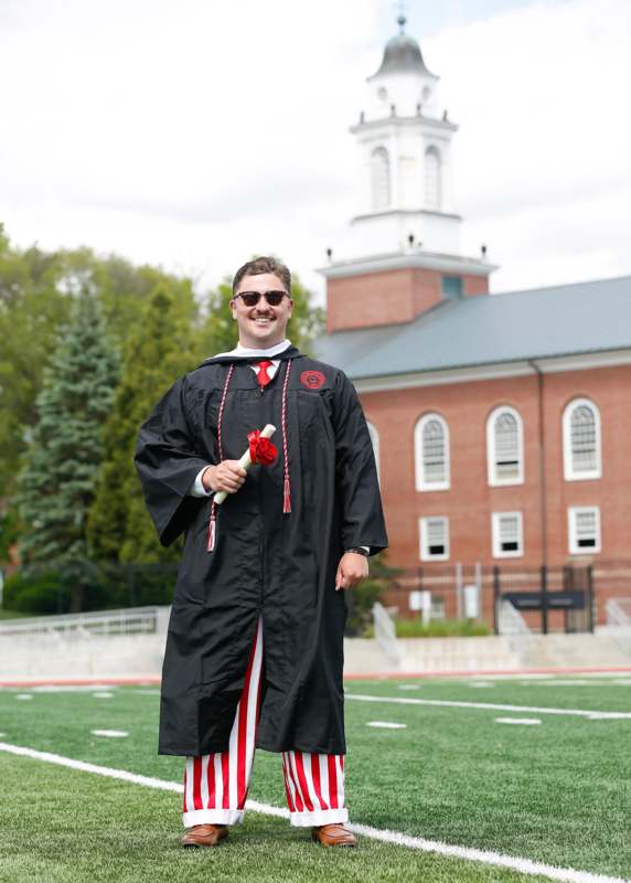 a man in a graduation gown