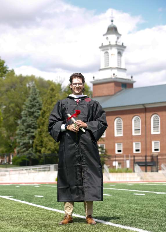 a man in a graduation gown