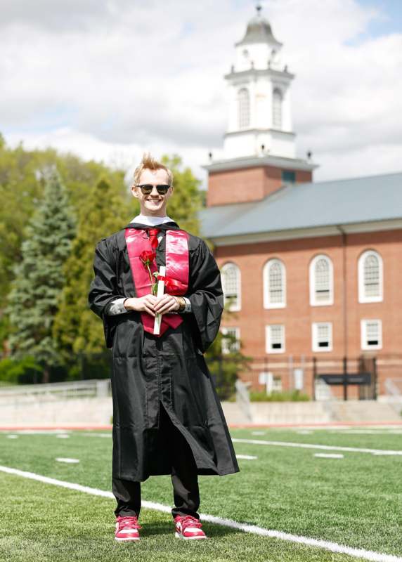 a man in a graduation gown