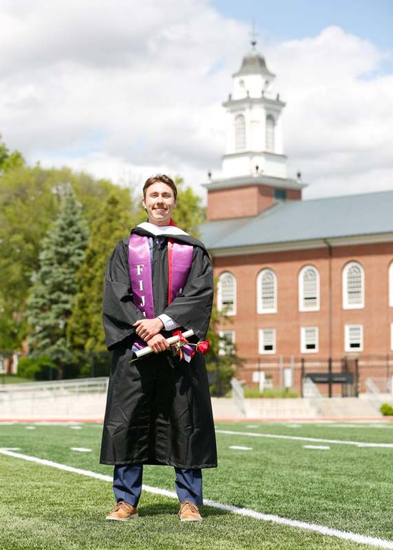 a man in a graduation gown