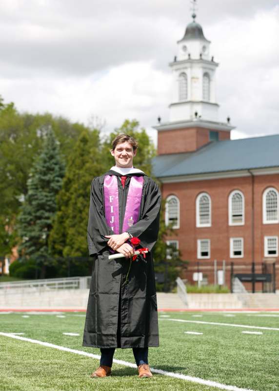 a man in a graduation gown