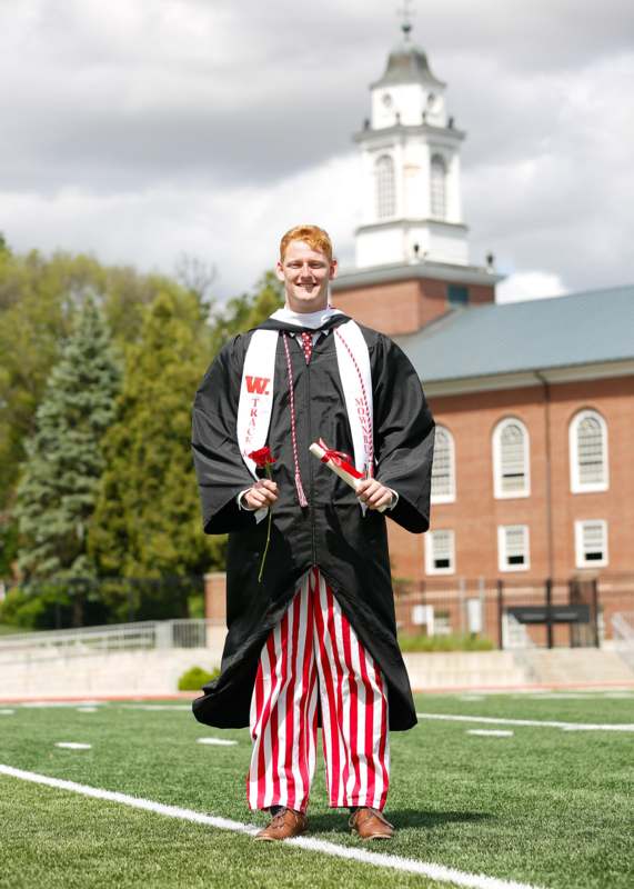 a man in a graduation gown