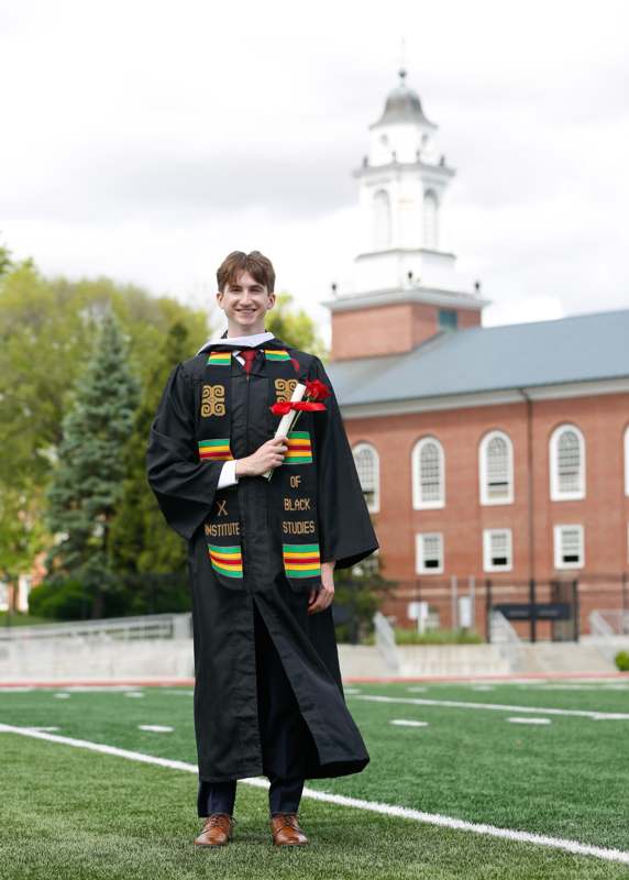 a man in a graduation gown