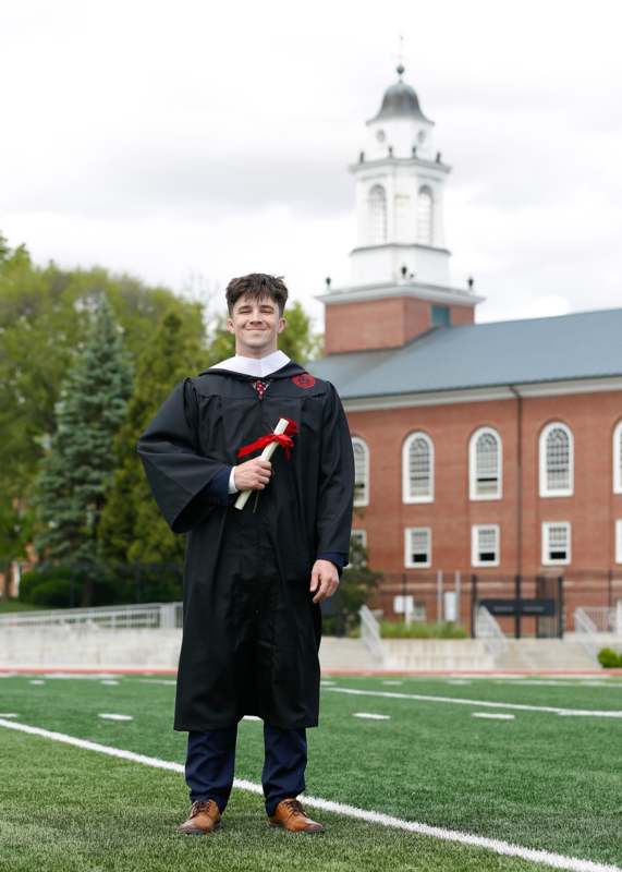a man in a graduation gown