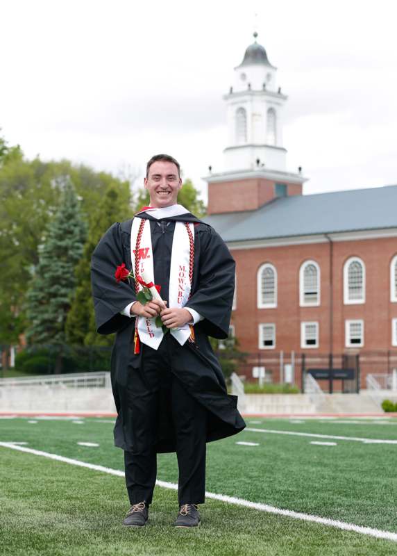 a man in a graduation gown