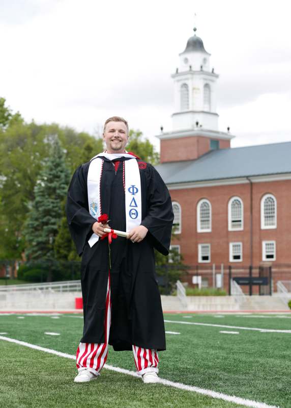 a man in a graduation gown