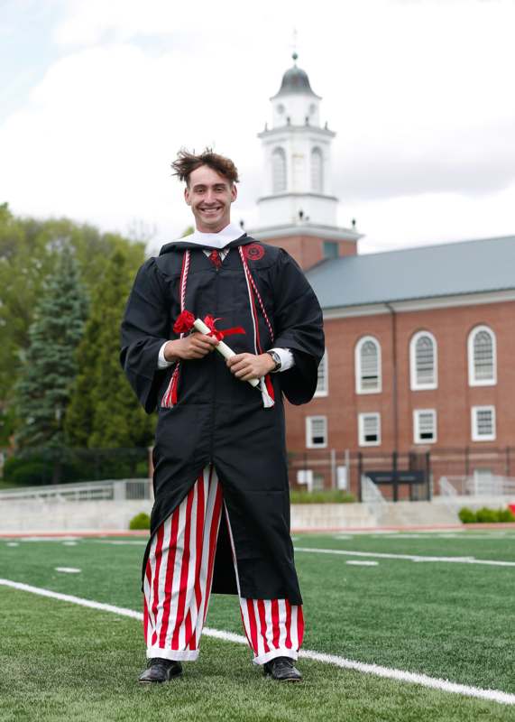 a man in a graduation gown